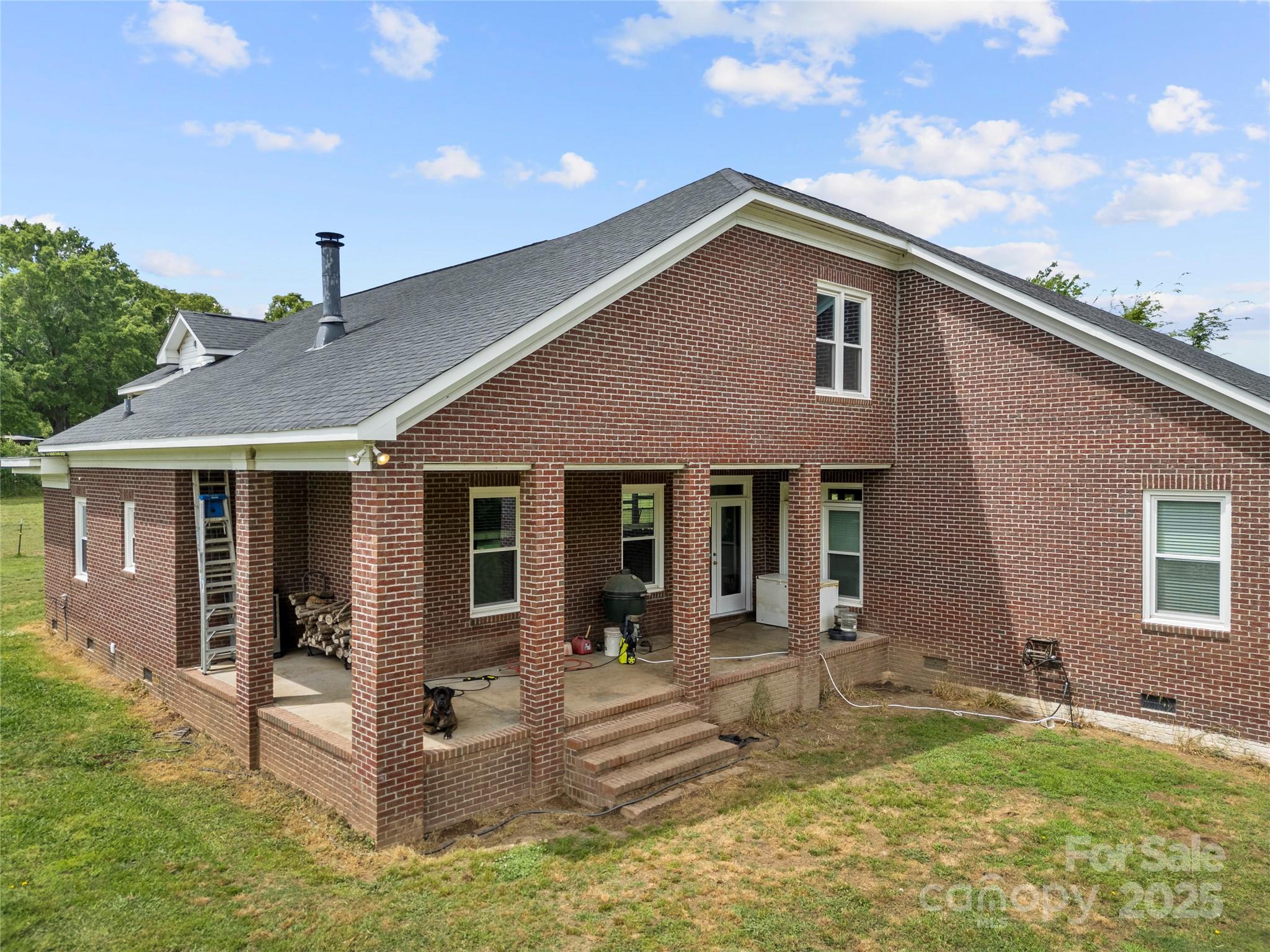 6218 Indian Trail Fairview Road Indian Trail, NC 28079 - Photo 40 of 46 a view of a house with backyard and porch