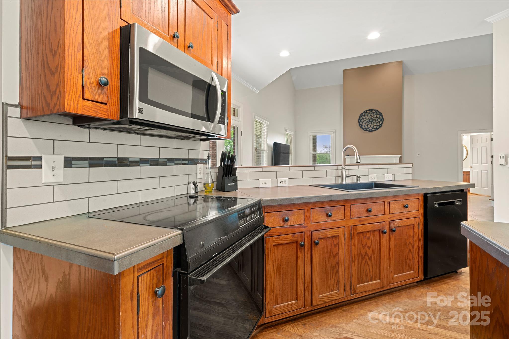 6218 Indian Trail Fairview Road Indian Trail, NC 28079 - Photo 4 of 46 a kitchen with stainless steel appliances granite countertop a sink stove and cabinets