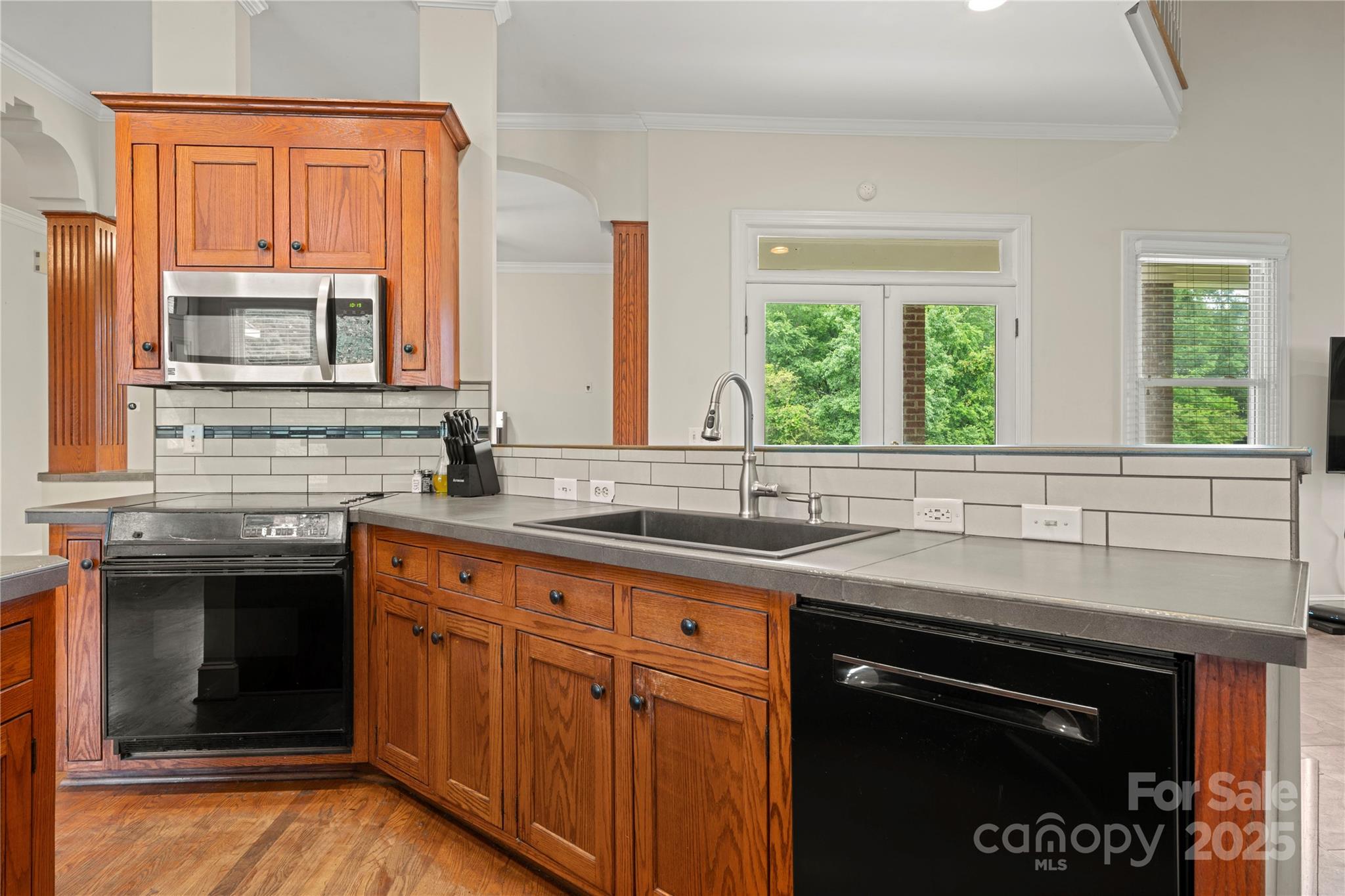 6218 Indian Trail Fairview Road Indian Trail, NC 28079 - Photo 5 of 46 a kitchen with stainless steel appliances granite countertop a sink stove and cabinets