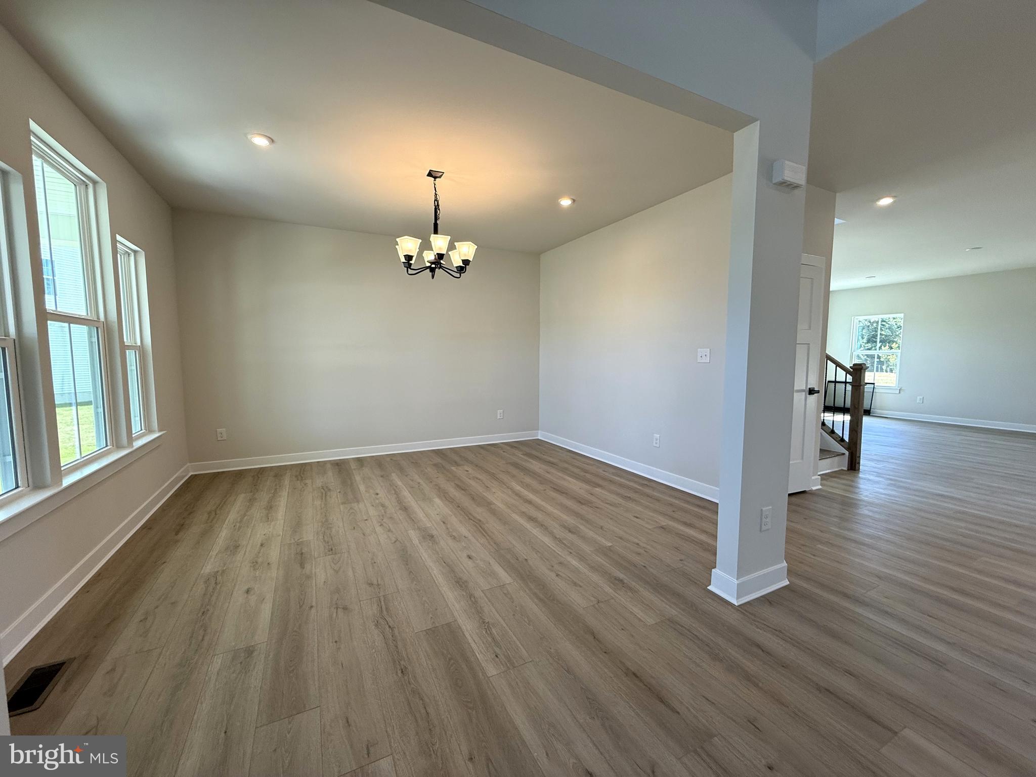 14566 Workman Circle Milton, DE 19968 - Photo 4 of 15 wooden floor in an empty room with a window