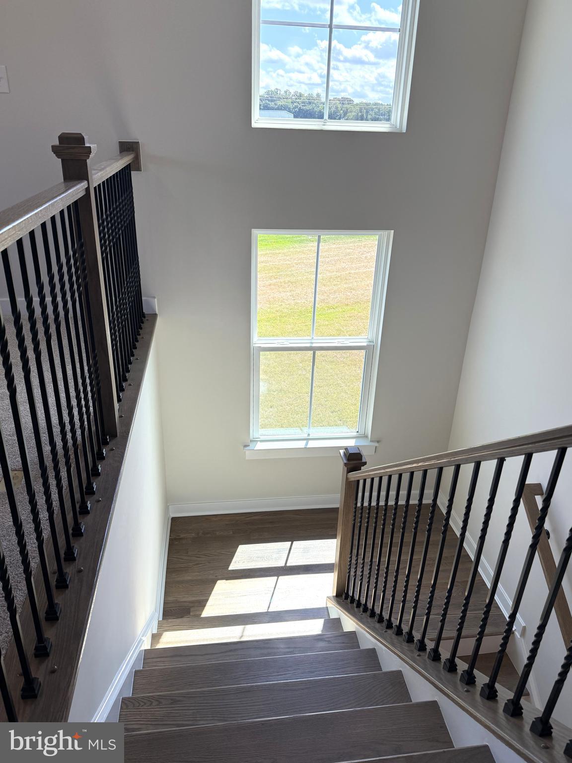 14566 Workman Circle Milton, DE 19968 - Photo 9 of 15 a view of staircase with white walls and a window