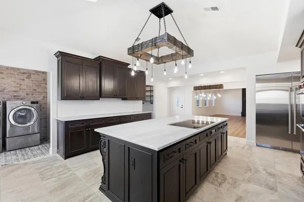 a kitchen with a counter space cabinets and stainless steel appliances