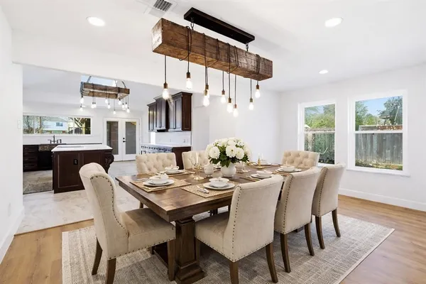 a kitchen with stainless steel appliances granite countertop a stove microwave and sink