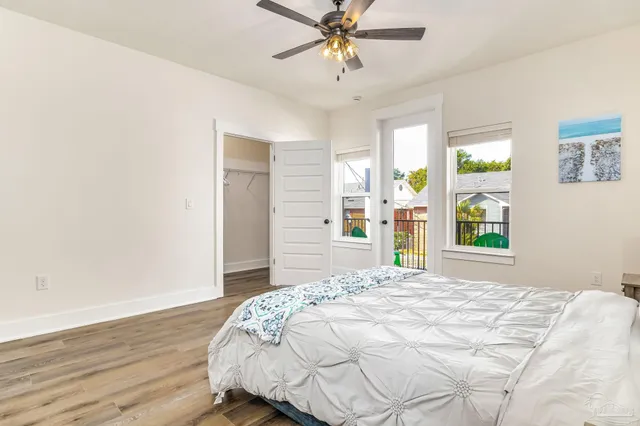 a bedroom with a bed and a window