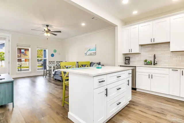 a large bed sitting in a bedroom next to a window