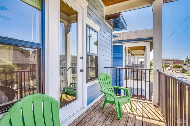a view of a chair and table in the balcony