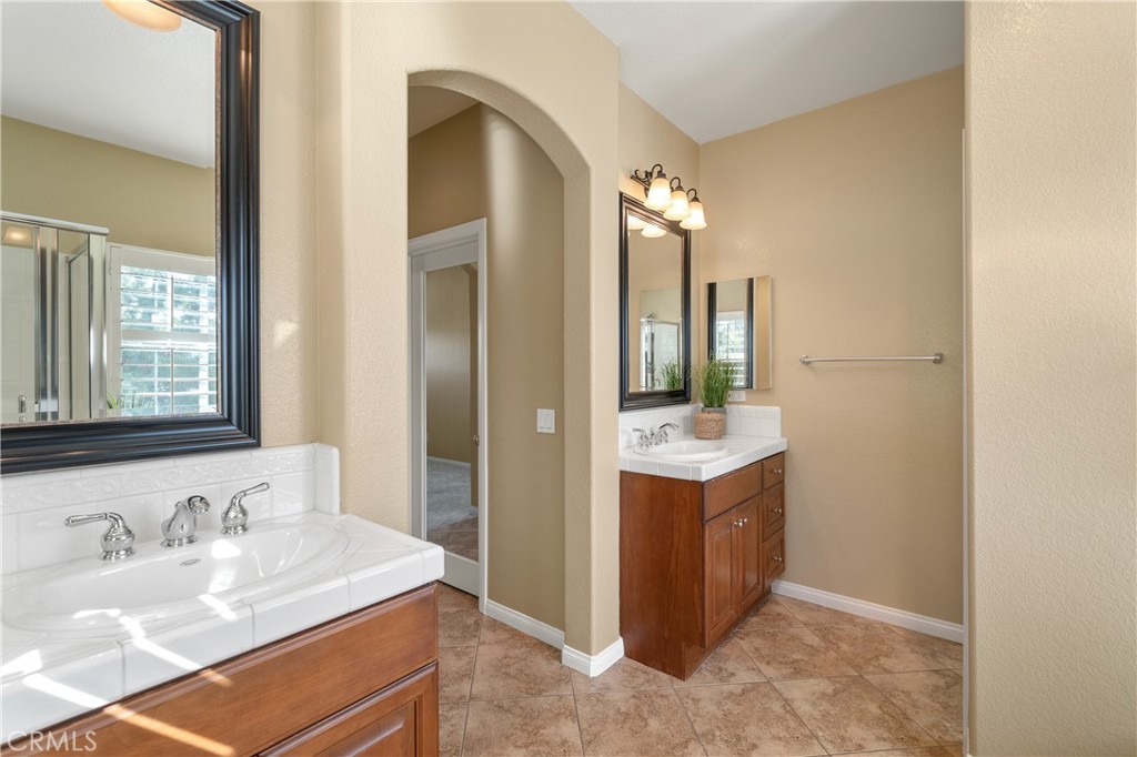 28817 Edenton Way Temecula, CA 92591 - Photo 33 of 56 a bathroom with a sink vanity granite tub and shower