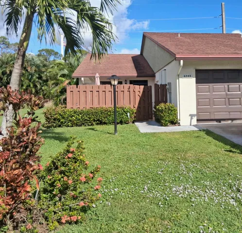 a view of a house with a garden