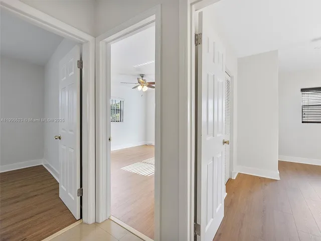 a view of a bathroom from the hallway