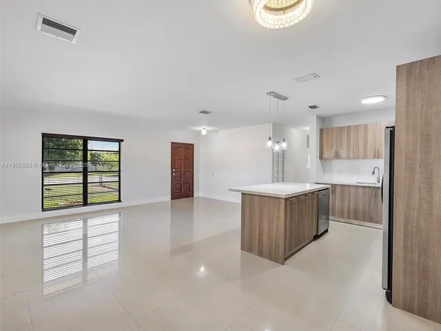 a view of kitchen and windows