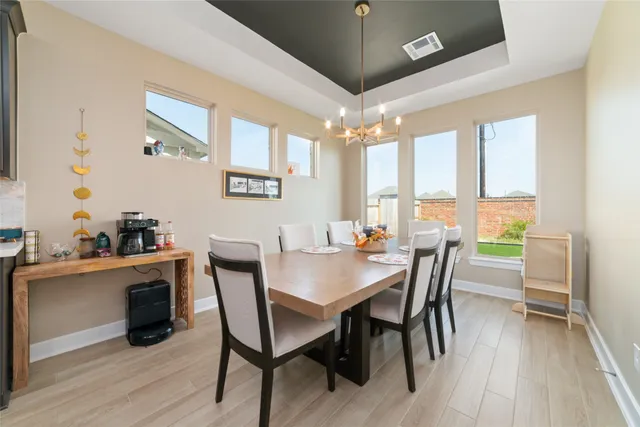 a kitchen with granite countertop a sink stove and cabinets