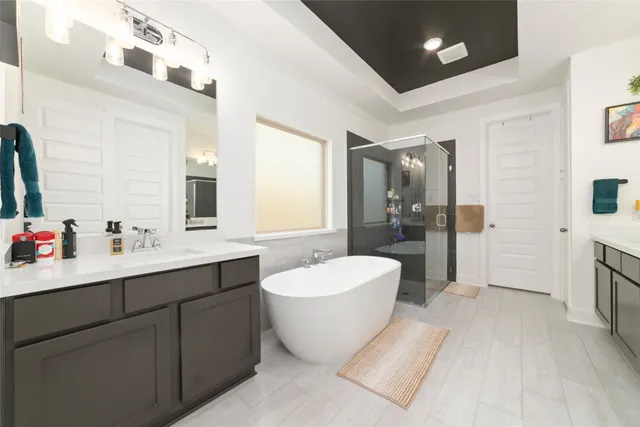 a bathroom with a sink vanity and mirror