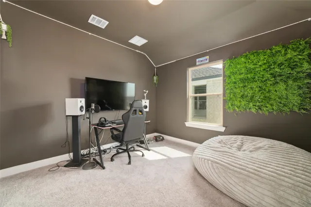 a bathroom with a sink a toilet a mirror and shower