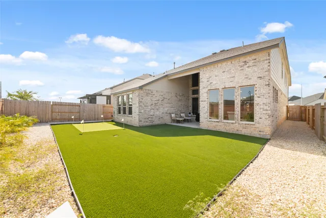 a view of an house with swimming pool and porch