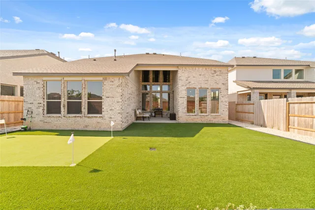 a view of a patio with a yard