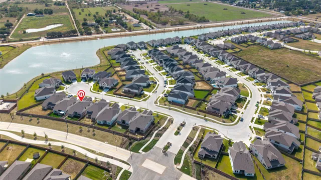 an aerial view of a house with a lake view