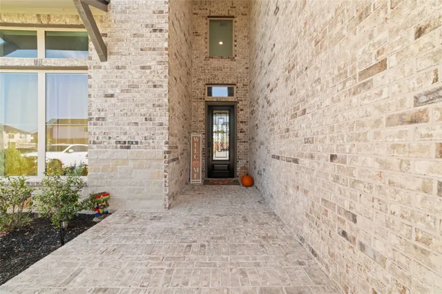 a view of a brick house with a small door