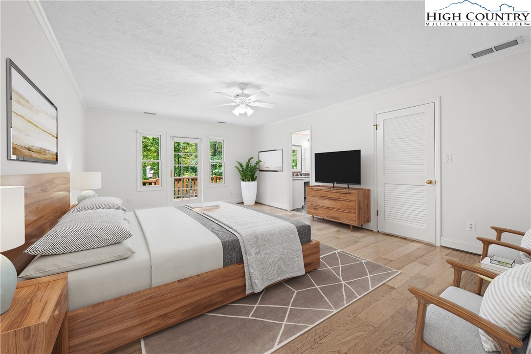 955 Dogwood Boone, NC 28607 - Photo 16 of 48 a bedroom with a large bed and a flat screen tv