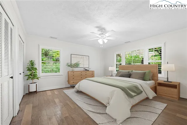 a bed room with a bed and a window