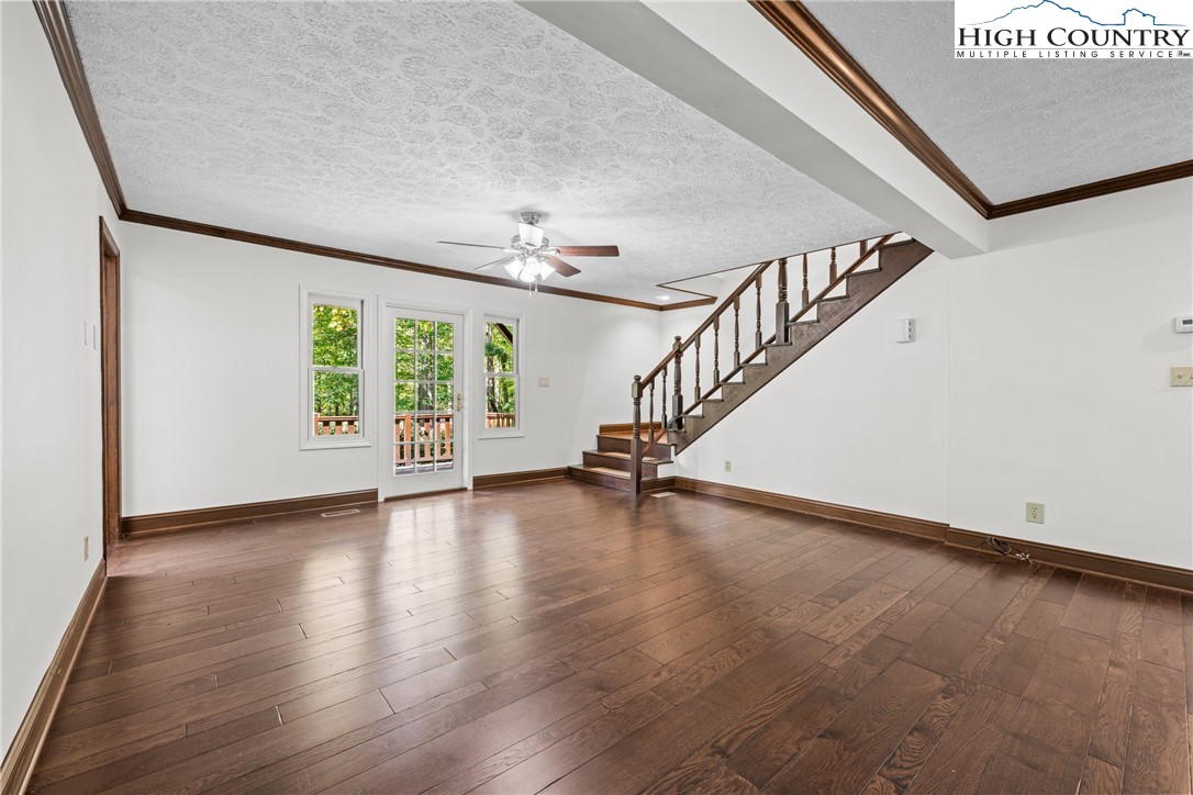 955 Dogwood Boone, NC 28607 - Photo 25 of 48 a view of an empty room with wooden floor and a window