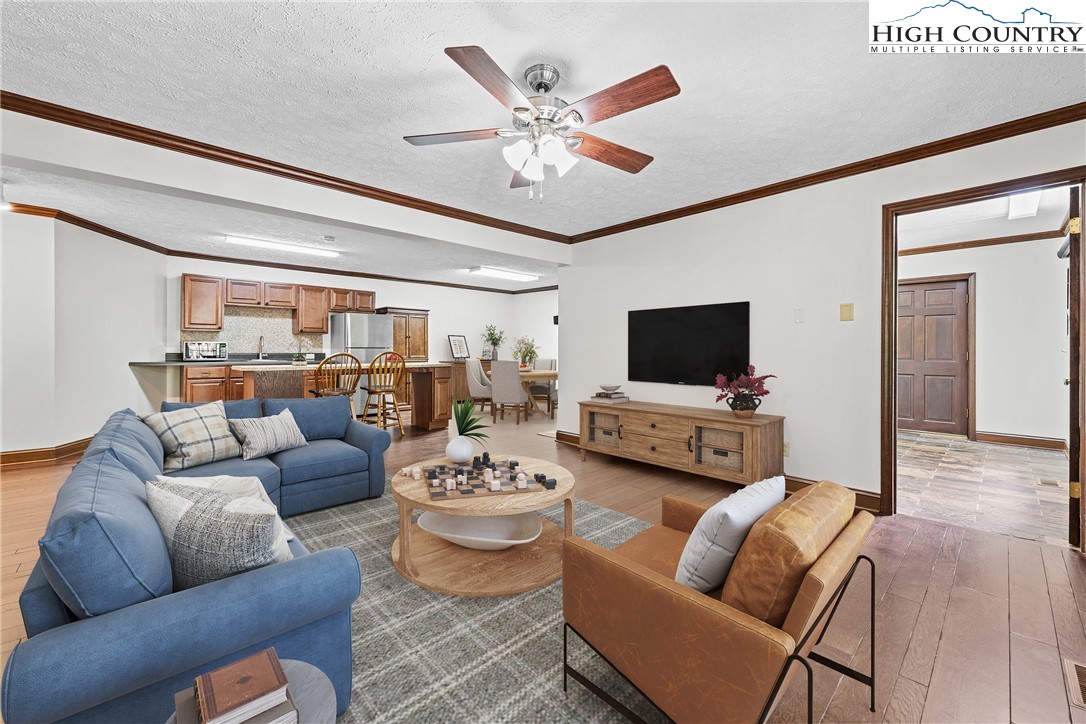 955 Dogwood Boone, NC 28607 - Photo 26 of 48 a living room with furniture kitchen view and a flat screen tv