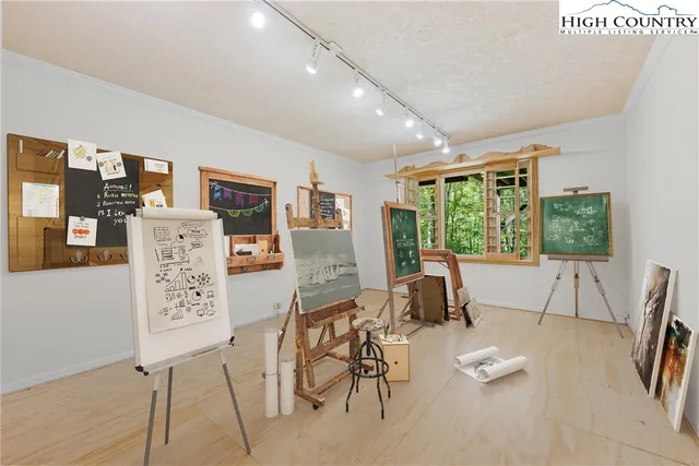 a living room with furniture and large window