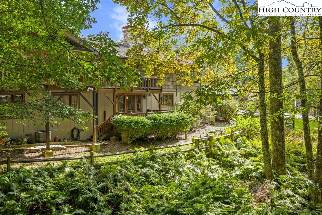 955 Dogwood Boone, NC 28607 - Photo 4 of 48 a backyard of a building with yard and outdoor seating