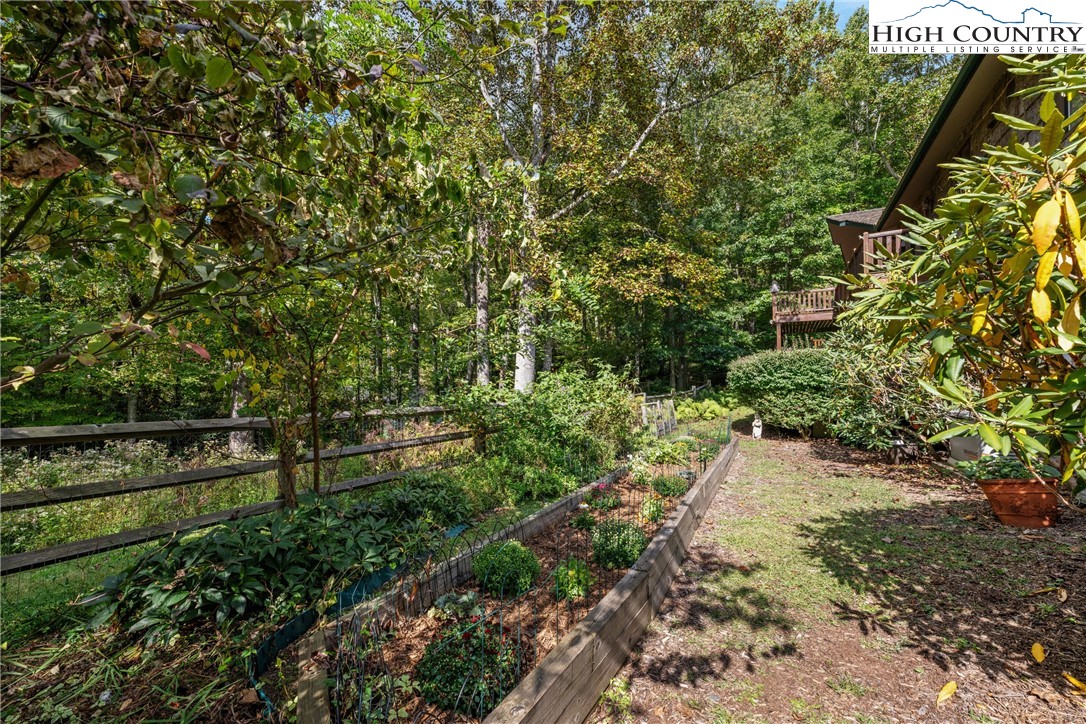 955 Dogwood Boone, NC 28607 - Photo 45 of 48 a view of a yard with plants and wooden fence