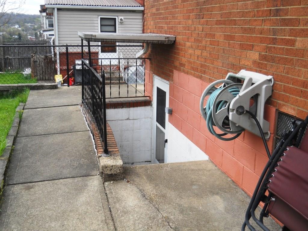 75 McKinnie Avenue McKees Rocks, PA 15136 - Photo 5 of 19 5) Exterior Rear: Walk out basement to rear yard.