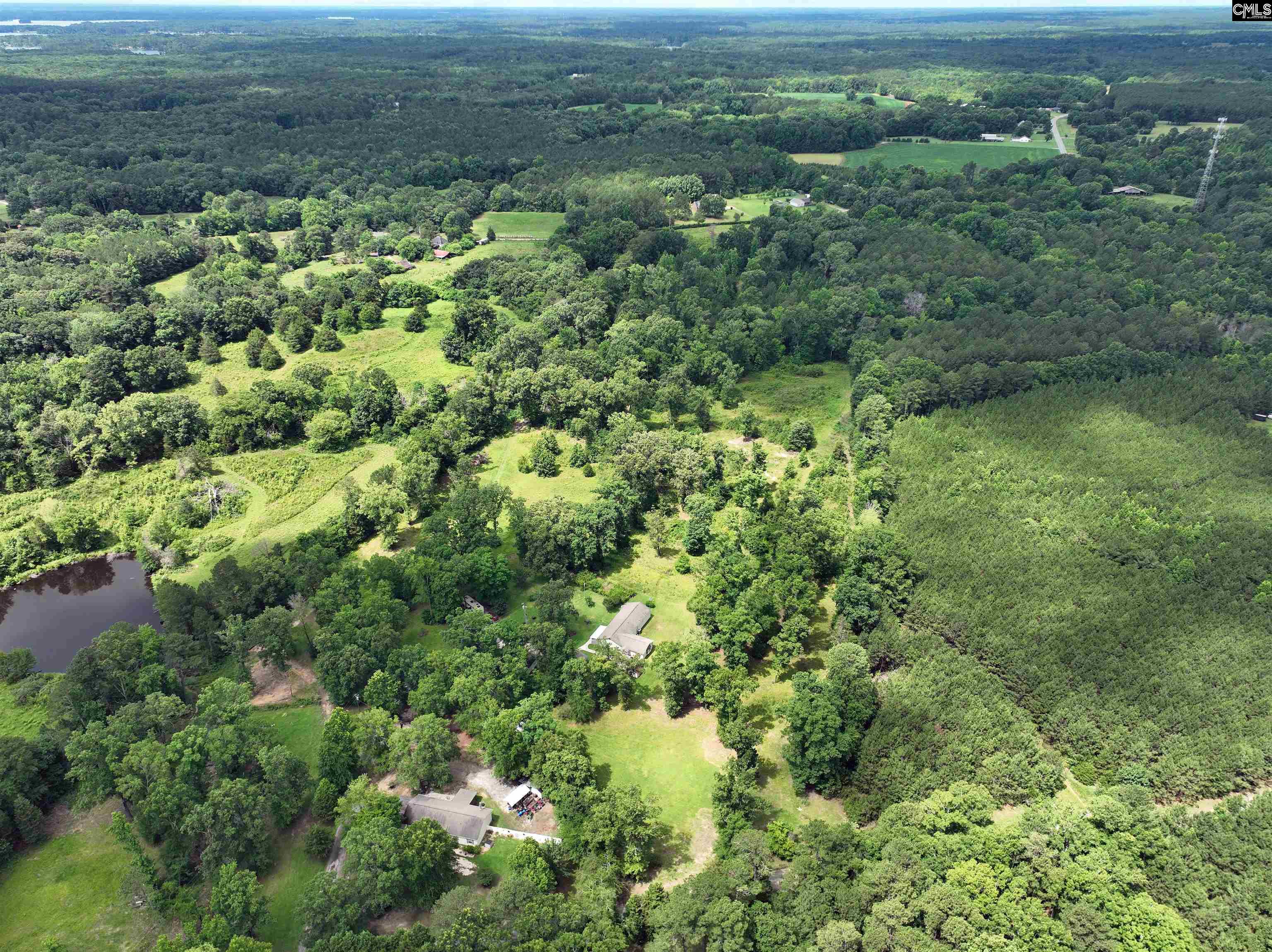 0 Rocky Branch Road Little Mountain, SC 29075 - Photo 21 of 24 an aerial view of residential houses with outdoor space and trees