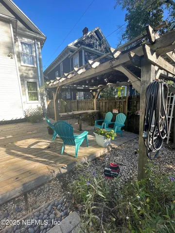 a view of a chairs and table in the patio