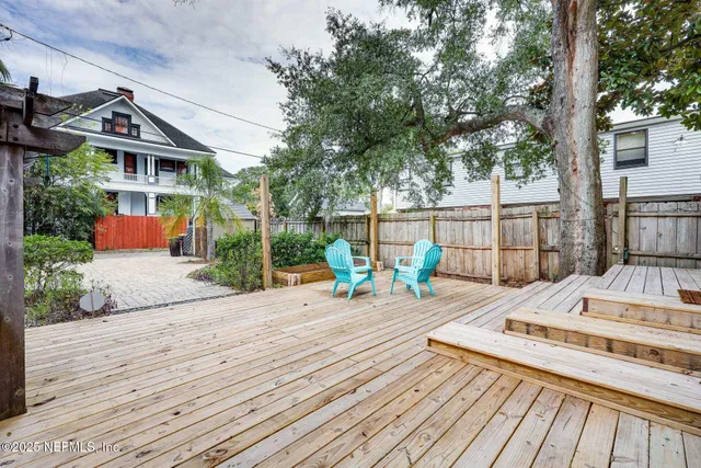 a view of a wooden deck with a patio