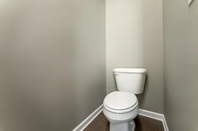 a spacious bedroom with a bed couch and window