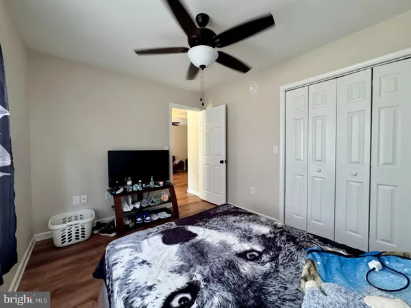 a bedroom with bed and a window
