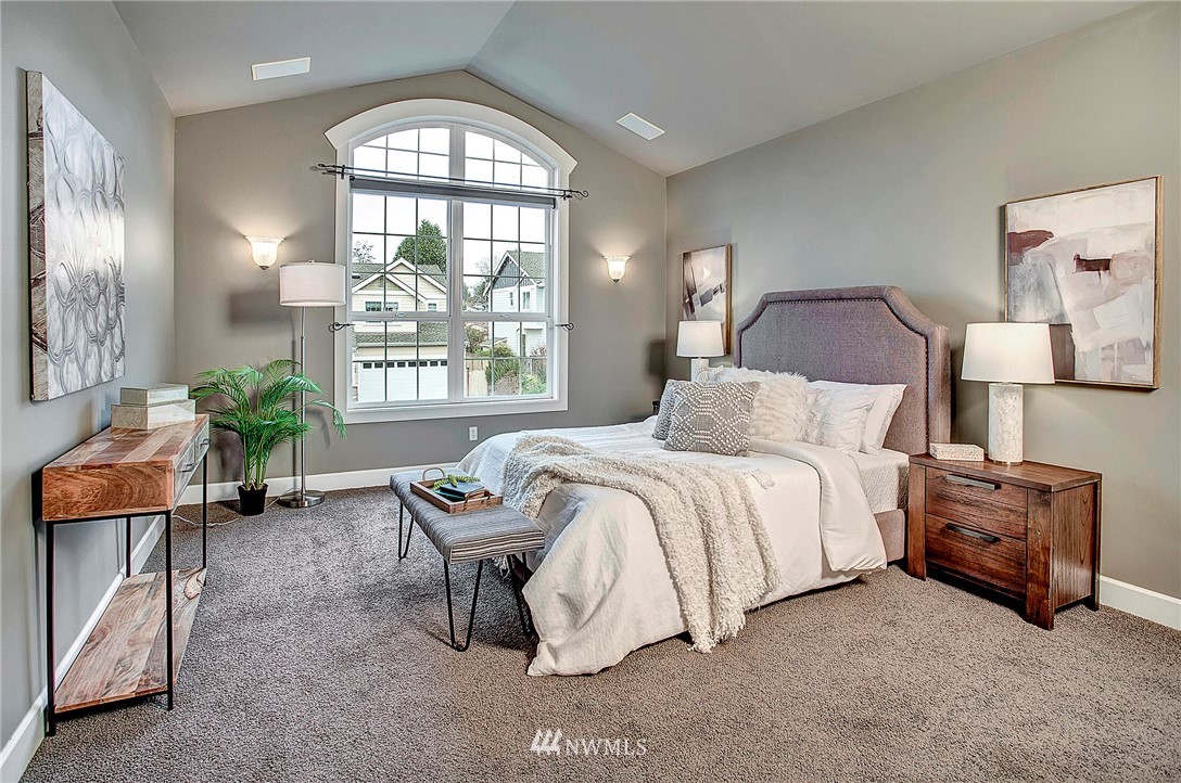 1101 North 27th Place Renton, WA 98056 - Photo 14 of 28 a spacious bedroom with a bed and a window