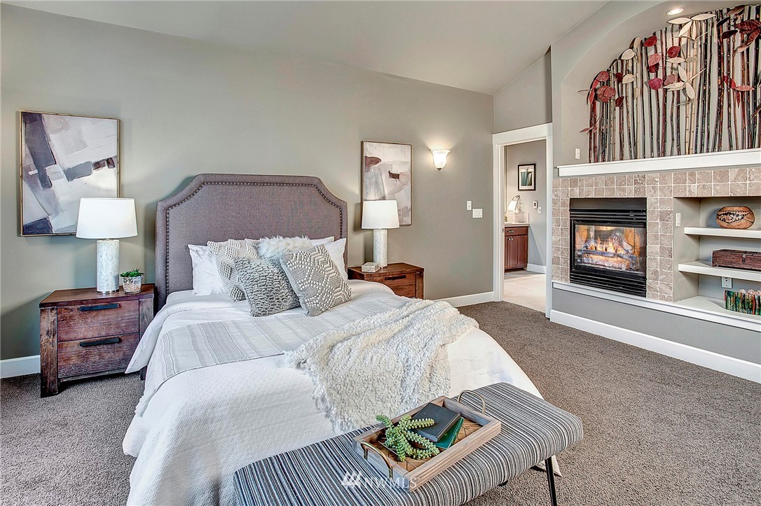 1101 North 27th Place Renton, WA 98056 - Photo 15 of 28 a bed room with a bed and a chair