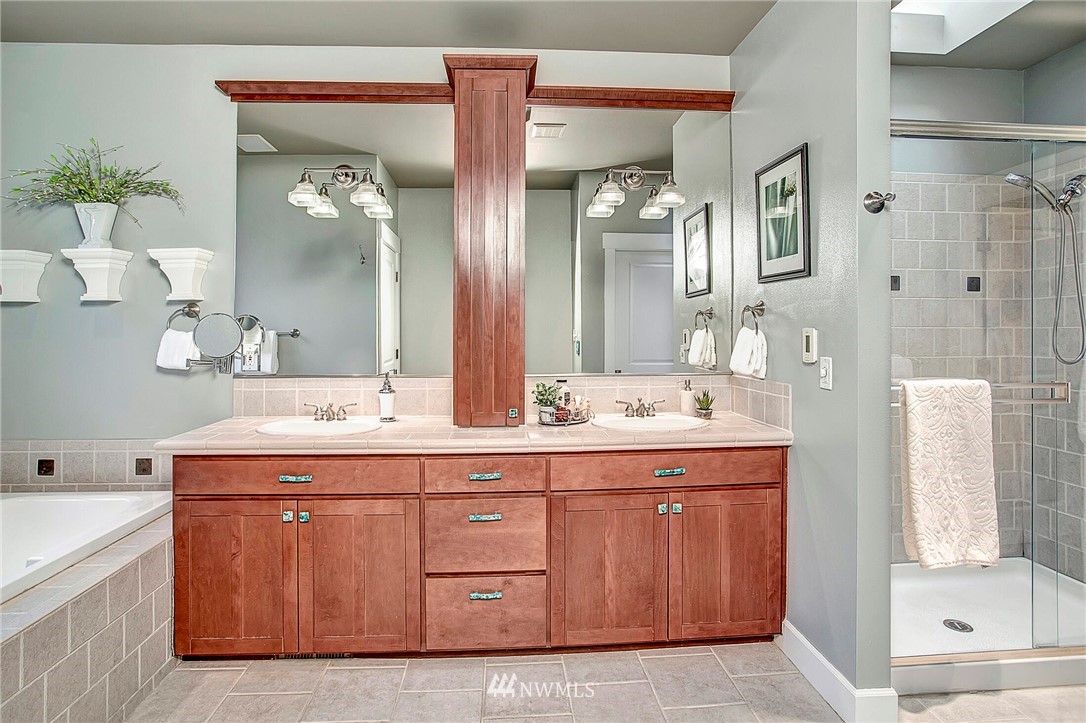 1101 North 27th Place Renton, WA 98056 - Photo 16 of 28 a bathroom with a granite countertop sink and a mirror