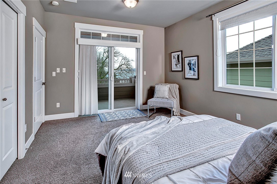 1101 North 27th Place Renton, WA 98056 - Photo 17 of 28 a bedroom with a bed and a window