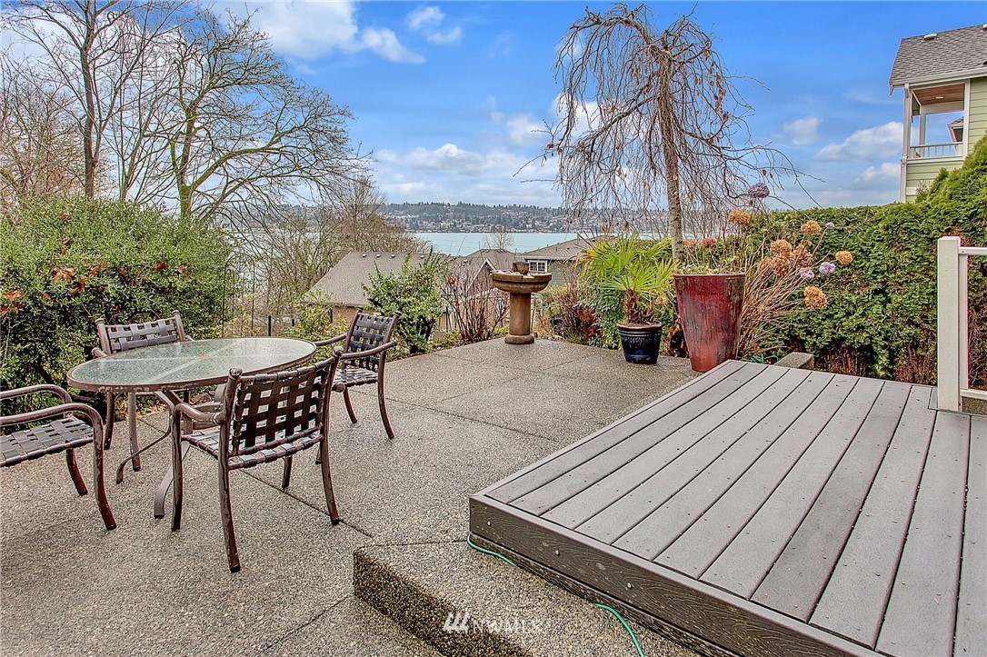 1101 North 27th Place Renton, WA 98056 - Photo 22 of 28 a view of a patio with table and chairs and potted plants