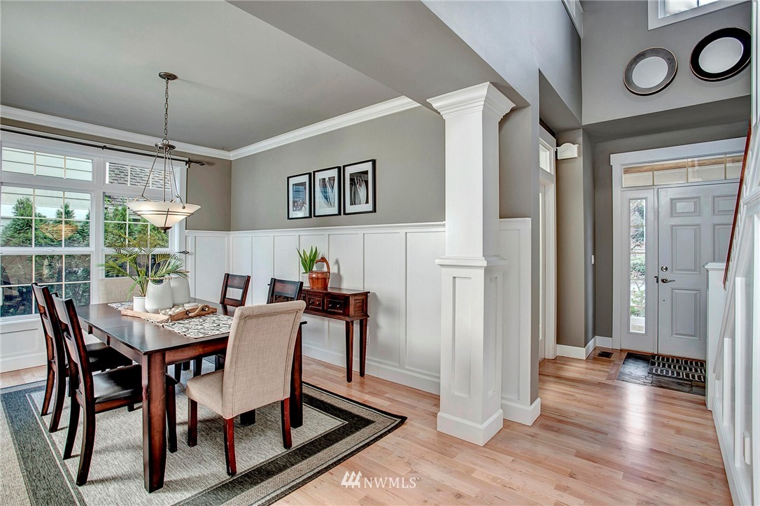 1101 North 27th Place Renton, WA 98056 - Photo 5 of 28 a view of a dining room with furniture window and wooden floor