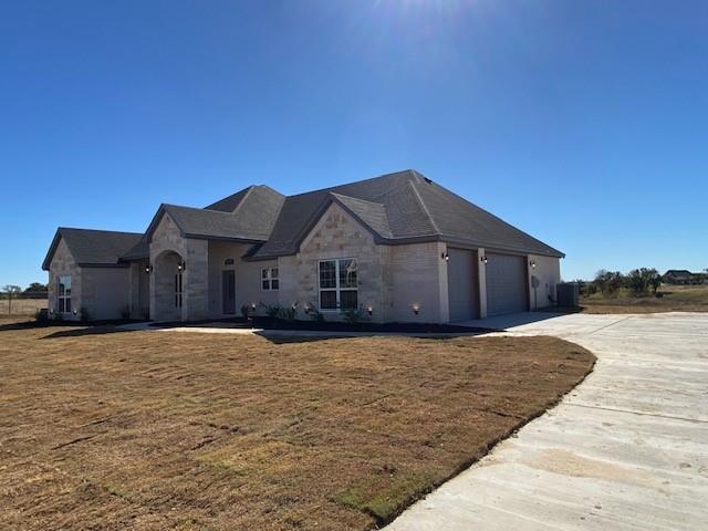 165 Coalson Crossing Azle, TX 76020 - Photo 2 of 23 a house with yard in front of it