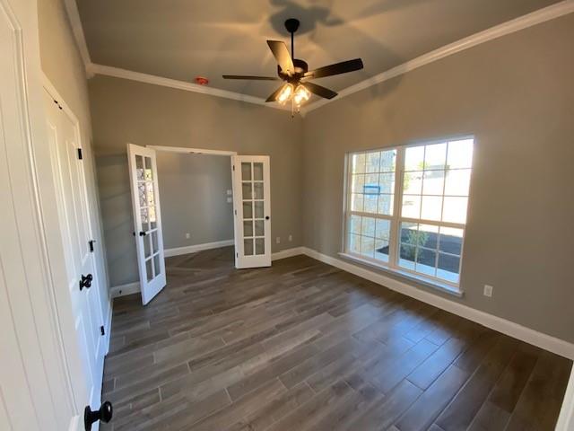 165 Coalson Crossing Azle, TX 76020 - Photo 4 of 23 an empty room with wooden floor fan and windows