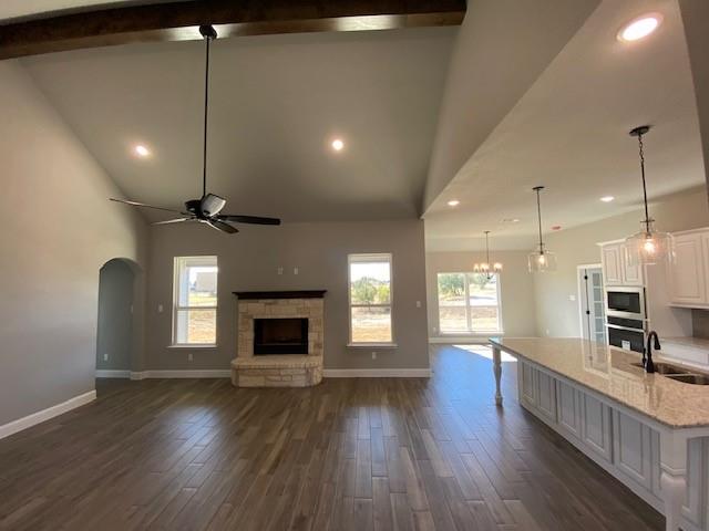 165 Coalson Crossing Azle, TX 76020 - Photo 5 of 23 a view of a kitchen with a sink and a fireplace