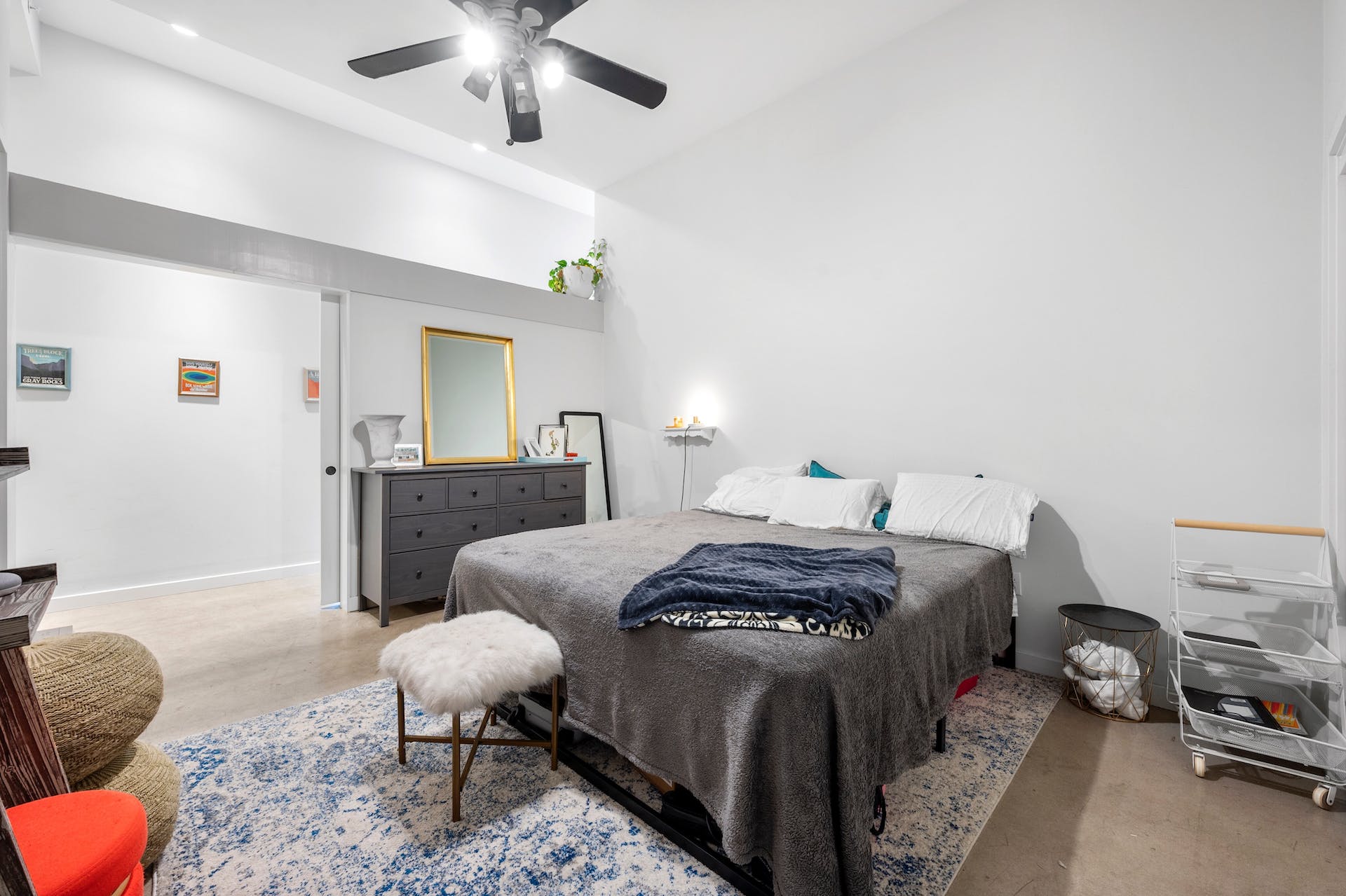 507 Sabine Street, Unit 908 Austin, TX 78701 - Photo 15 of 26 a bedroom with furniture and a mirror