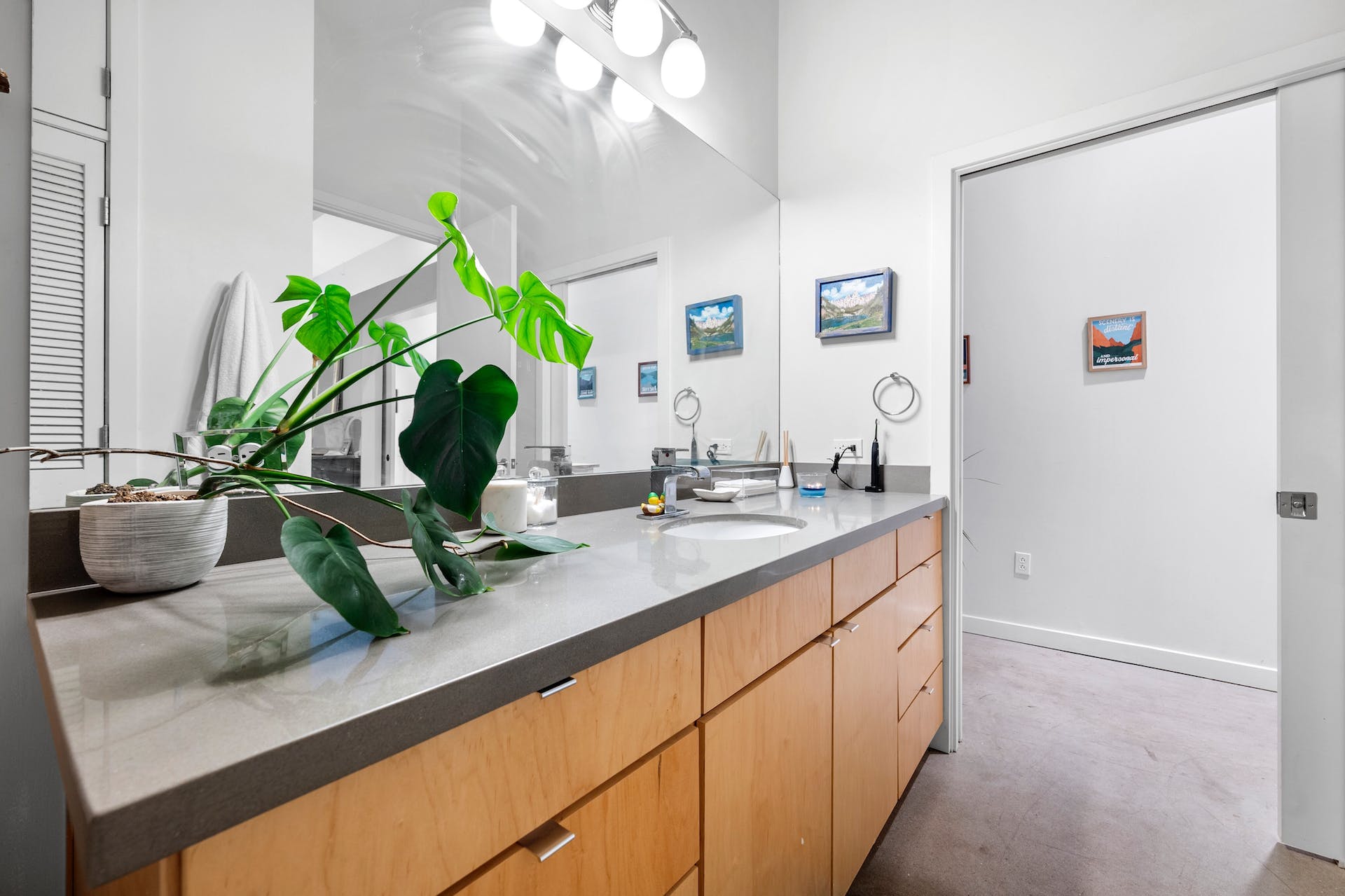 507 Sabine Street, Unit 908 Austin, TX 78701 - Photo 17 of 26 a bathroom with sink and a mirror
