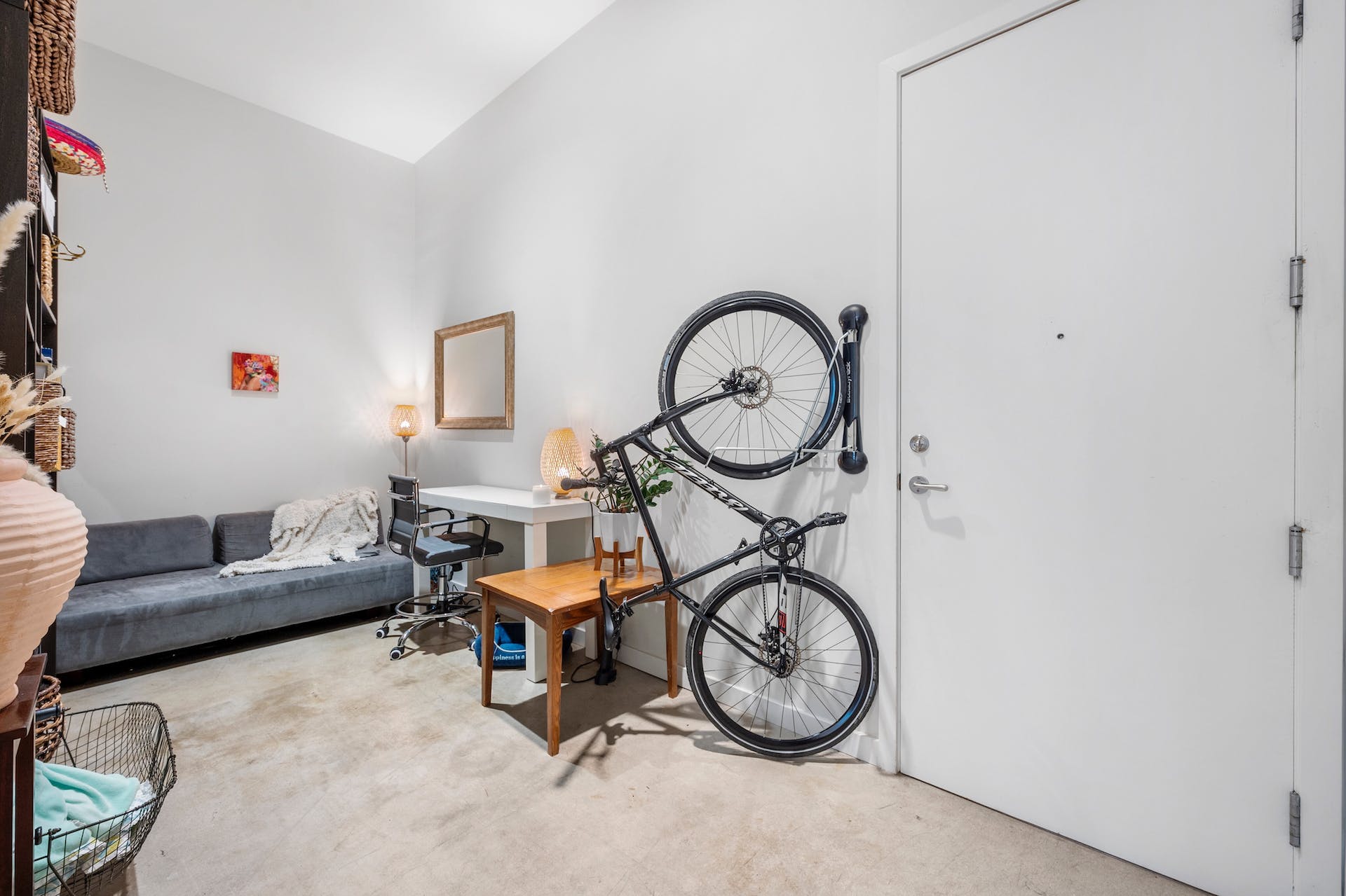 507 Sabine Street, Unit 908 Austin, TX 78701 - Photo 18 of 26 a living room with furniture a clock and white walls