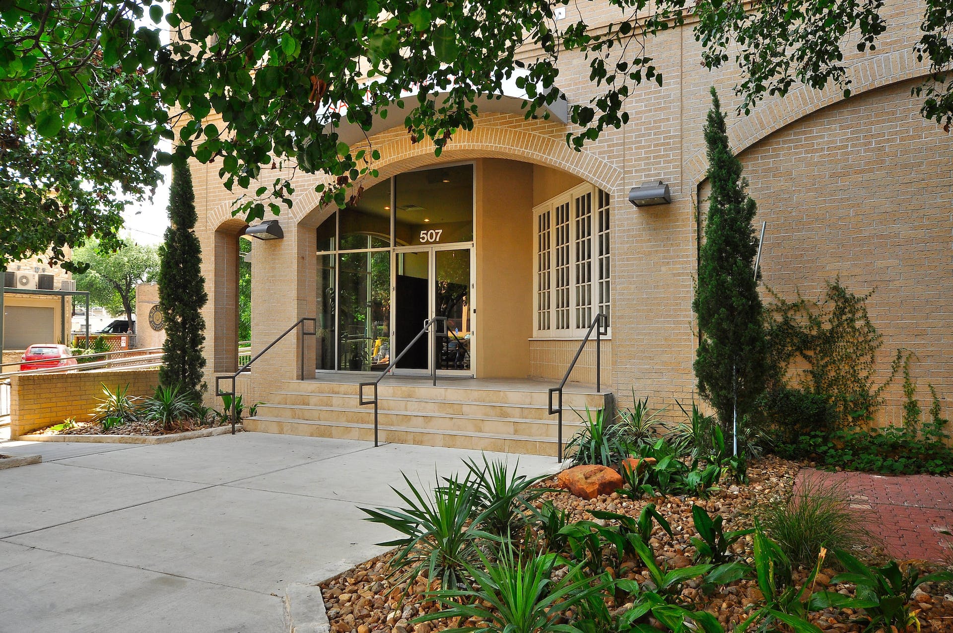 507 Sabine Street, Unit 908 Austin, TX 78701 - Photo 3 of 26 a front view of a house with a yard