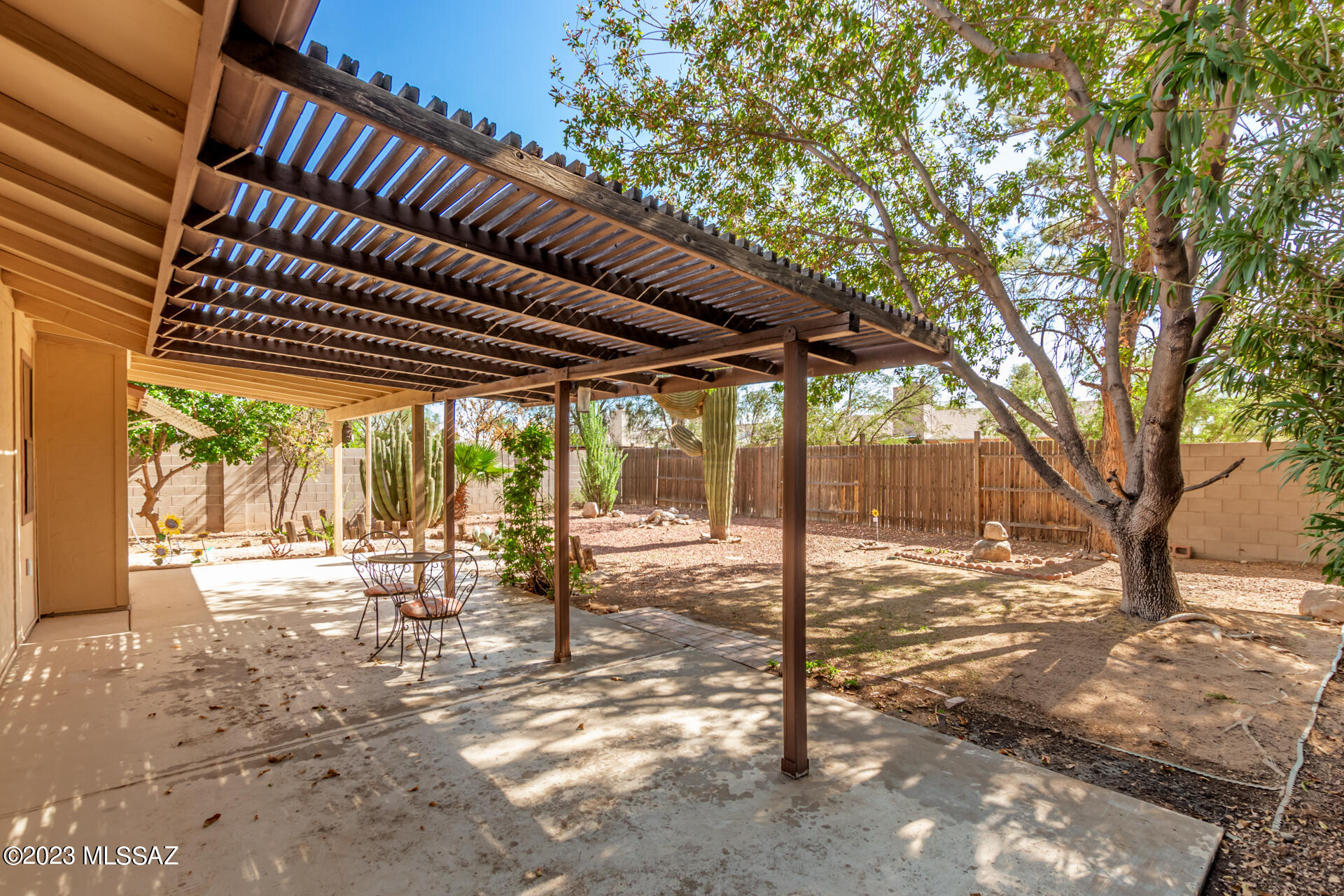 2701 West Firebrook Road Tucson, AZ 85741 - Photo 22 of 28 a view of a yard with wooden fence and large trees