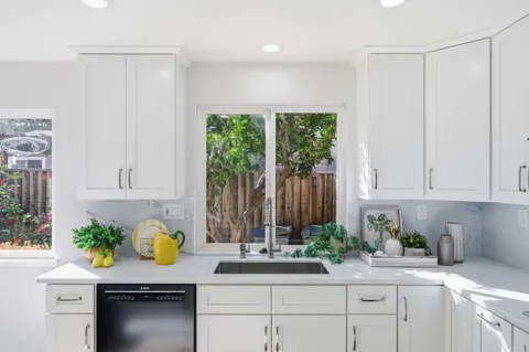 a kitchen with sink and window