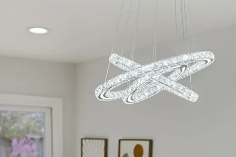 a view of a chandelier fan and wooden floor